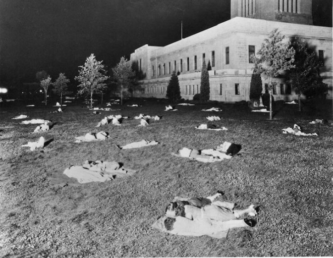 The State Capitol Building, Lincoln, With people in street clothes asleep on the lawn during hot days of the 1930's, Picture July 25, 1936